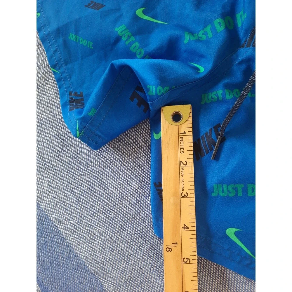 Nike Mens XL Blue Just Do It Swoosh All Over Print Swim Trunks Shorts NESSA474